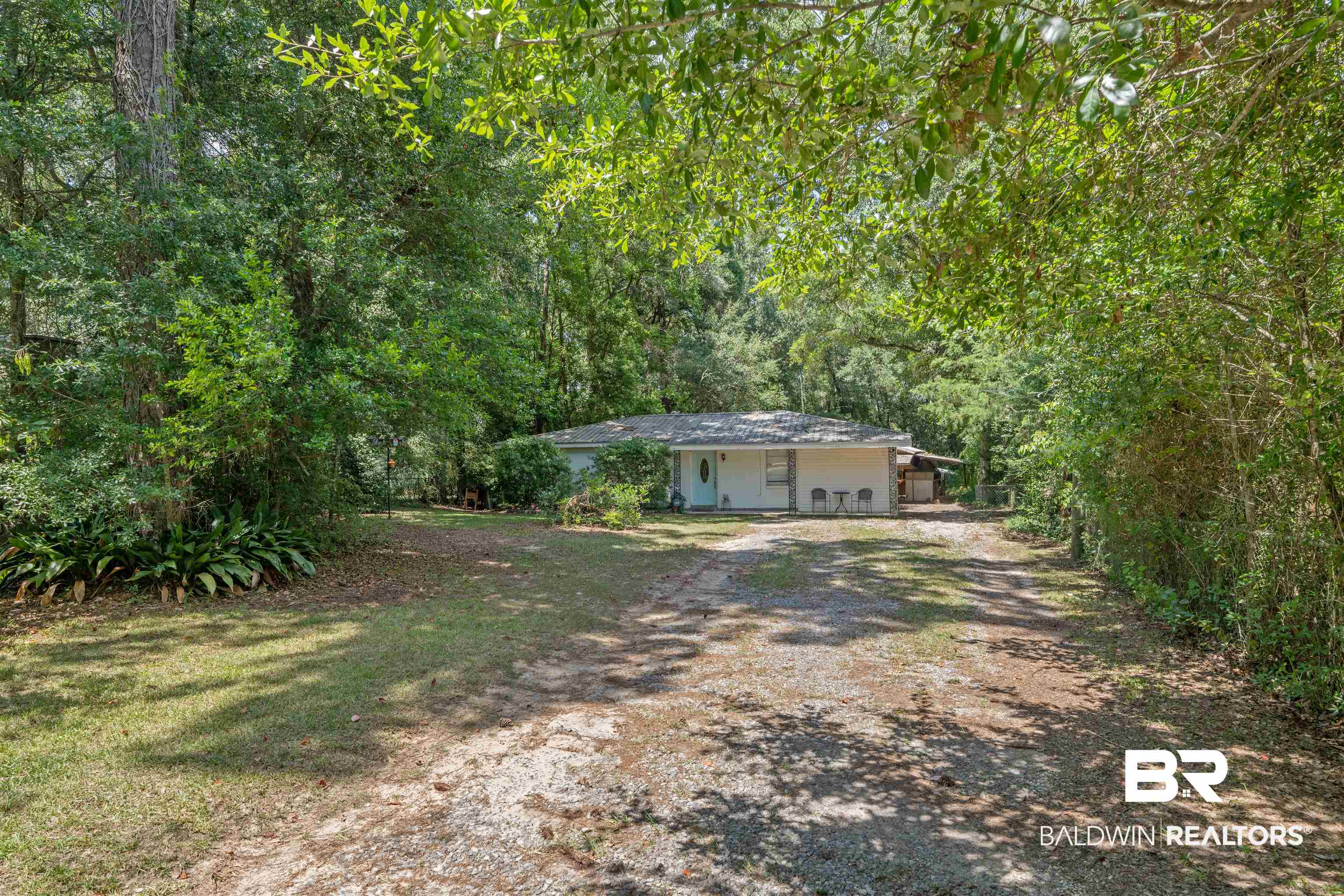 922 Dauphine Circle Daphne, AL 36526 - Photo 1 of 29 View of yard featuring dirt driveway and a wooded view