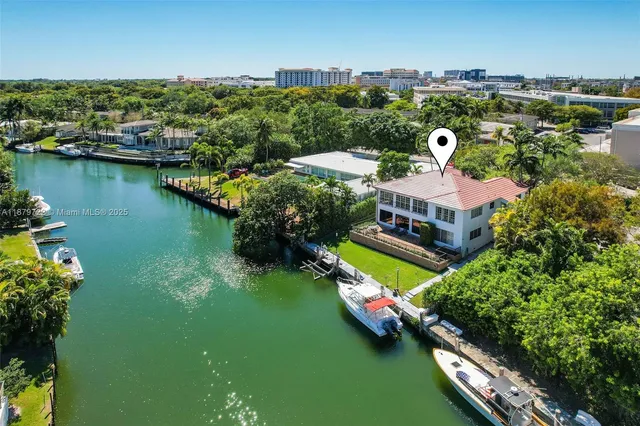 an aerial view of a house with a garden lake view