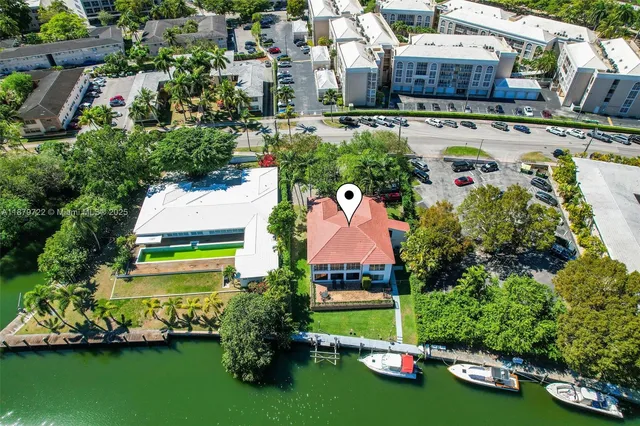 an aerial view of a house with a garden and yard