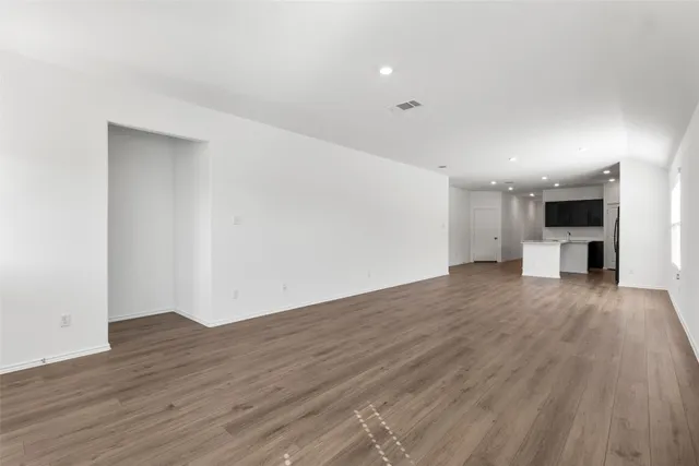 a kitchen with stainless steel appliances a refrigerator stove a sink and a microwave