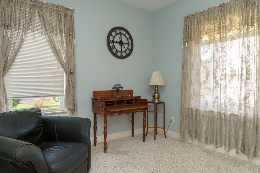 177 Lawton Street Fall River, MA 02721 - Photo 12 of 26 a living room with a couch and a window