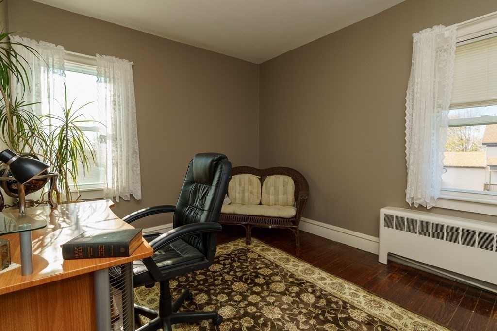 177 Lawton Street Fall River, MA 02721 - Photo 14 of 26 a view of a workspace with furniture and a window