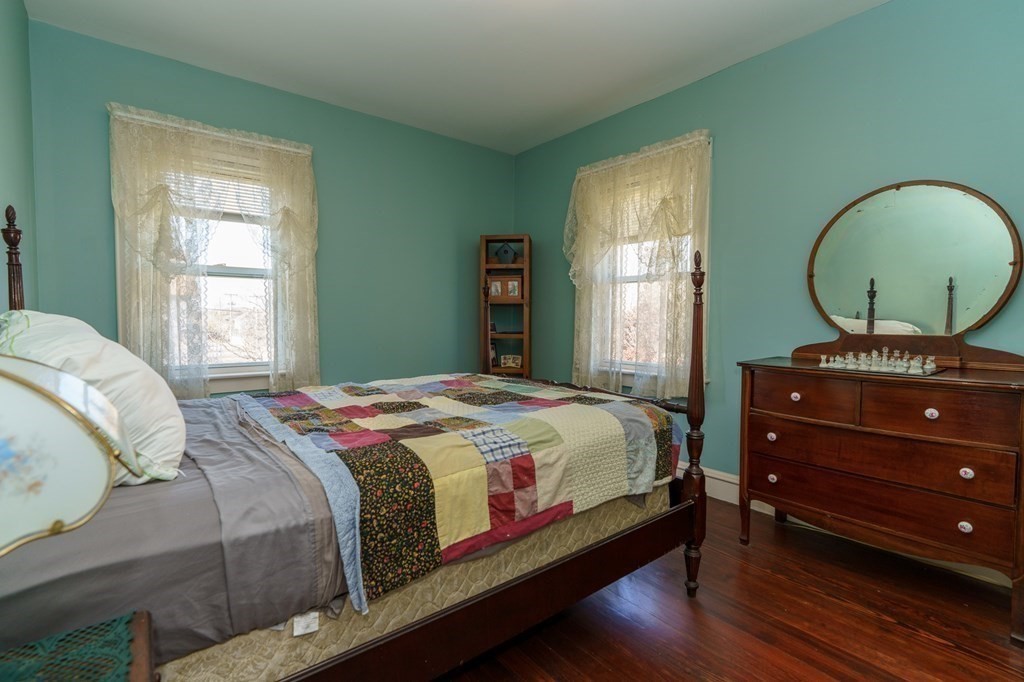 177 Lawton Street Fall River, MA 02721 - Photo 17 of 26 a bedroom with a bed window and a mirror