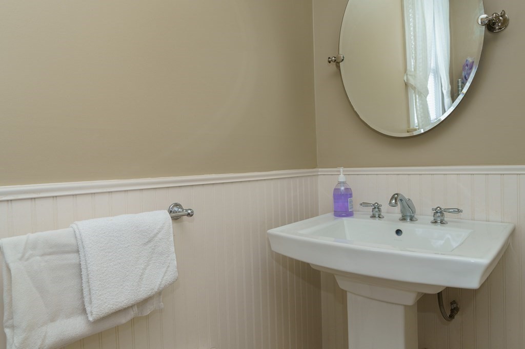 177 Lawton Street Fall River, MA 02721 - Photo 22 of 26 a bathroom with a sink and a mirror