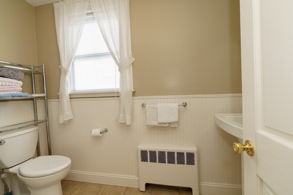 177 Lawton Street Fall River, MA 02721 - Photo 24 of 26 a bathroom with a sink and a toilet