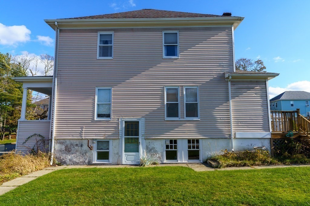 177 Lawton Street Fall River, MA 02721 - Photo 25 of 26 a view of a house with a yard and plants