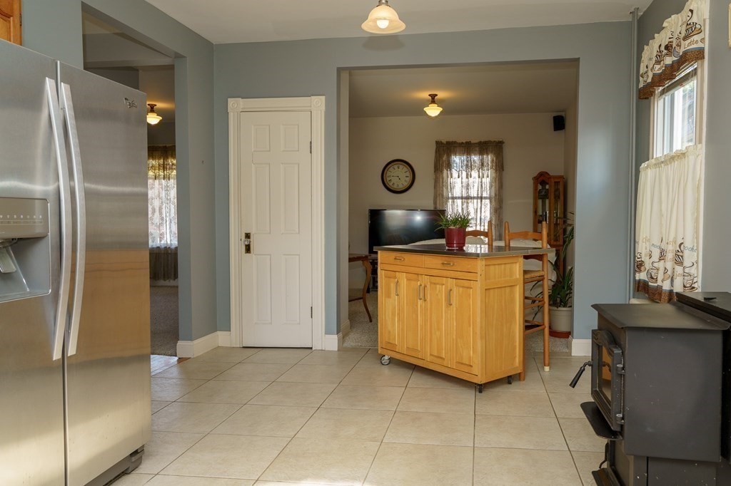 177 Lawton Street Fall River, MA 02721 - Photo 8 of 26 a view of a kitchen with storage and utility