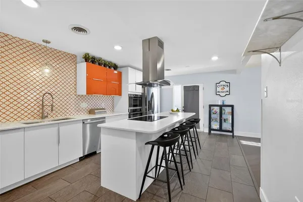 a kitchen with a sink and cabinets