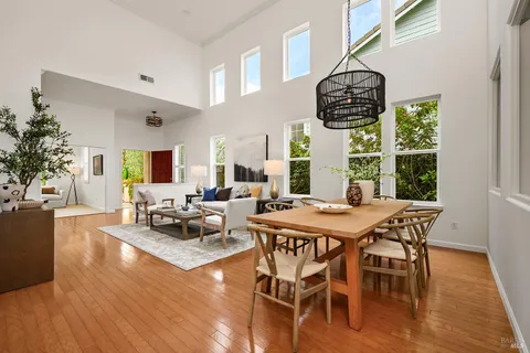 a view of a dining room with furniture window and wooden floor
