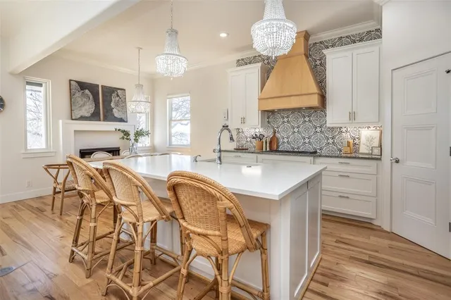 a kitchen with cabinets and stainless steel appliances