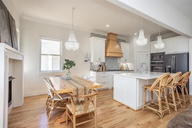 a kitchen with stainless steel appliances a refrigerator and cabinets