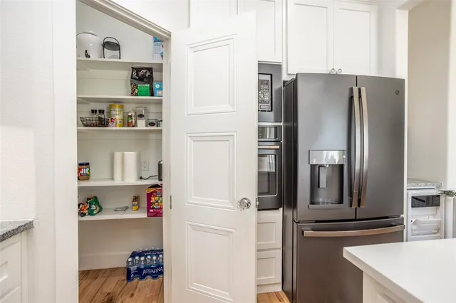 a dining room with furniture a fireplace and chandelier
