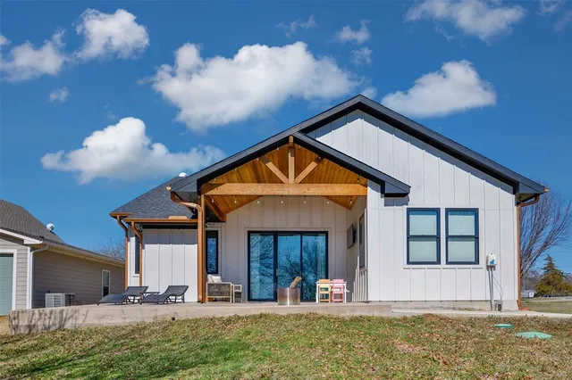 a view of house with yard and entertaining space