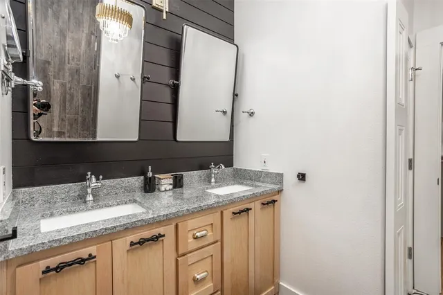 a bedroom with a bed and a night stand