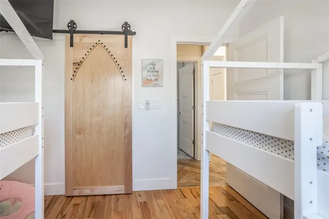 a view of a bathroom with a shower and a door