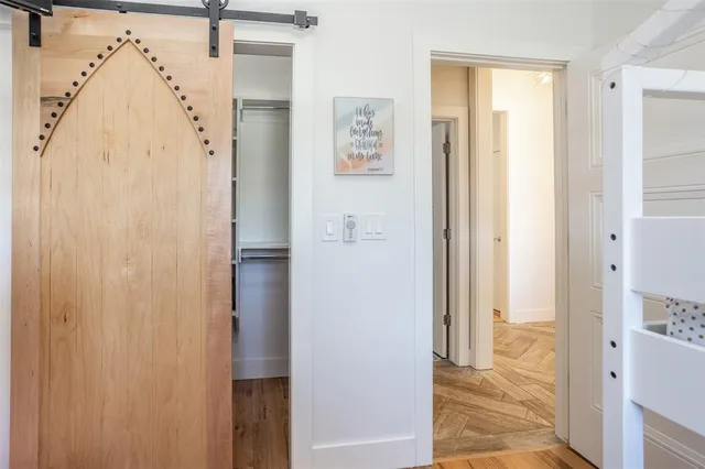 a living room with furniture gym equipment and a flat screen tv