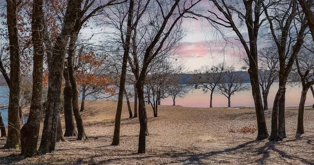 a living room with furniture a chandelier and a dining table