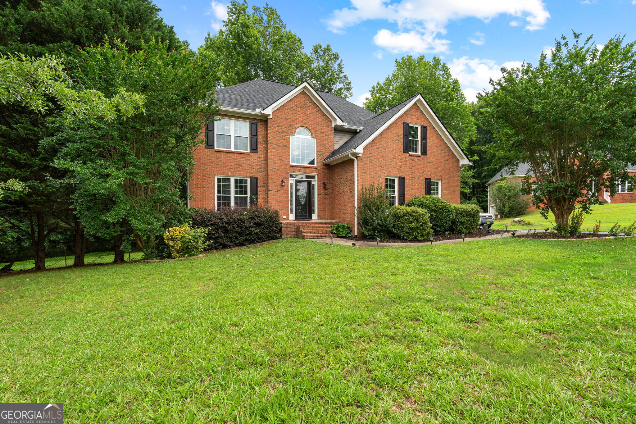 375 Gaelic Way Tyrone, GA 30290 - Photo 2 of 54 a front view of house with yard and green space