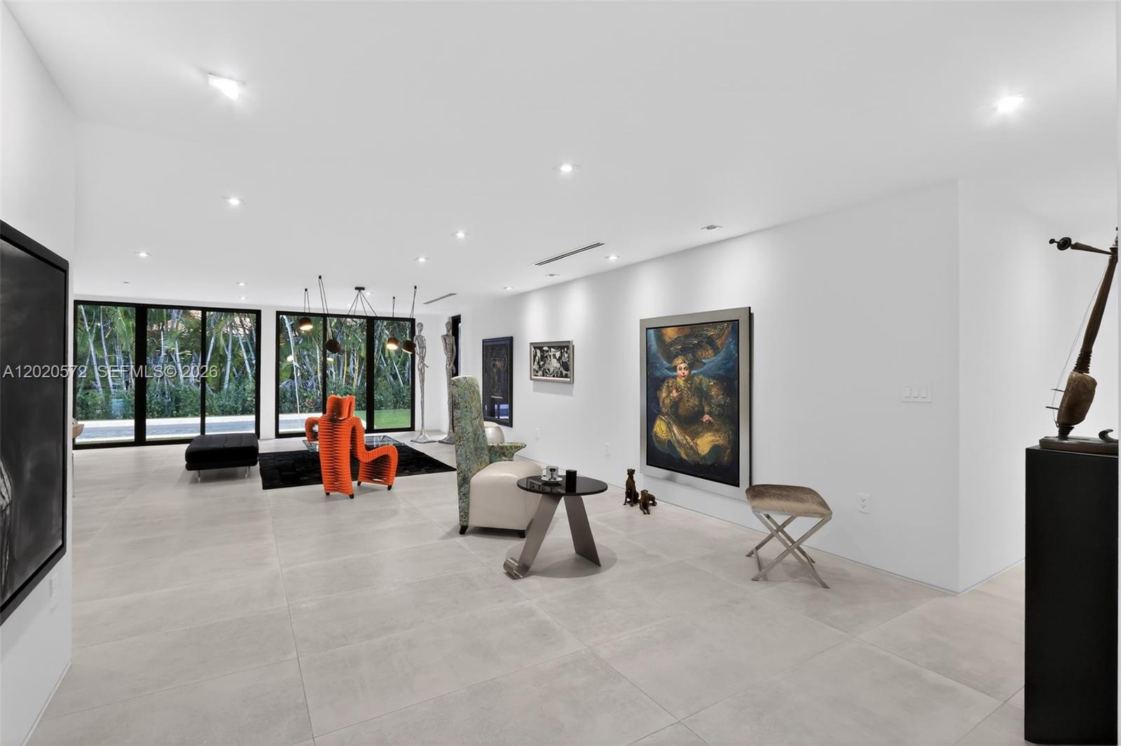 439 Hardee Road Coral Gables, FL 33146 - Photo 6 of 35 a living room with furniture and large windows