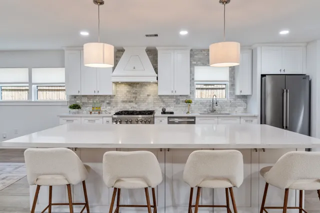 a bathroom with a granite countertop sink mirror and a