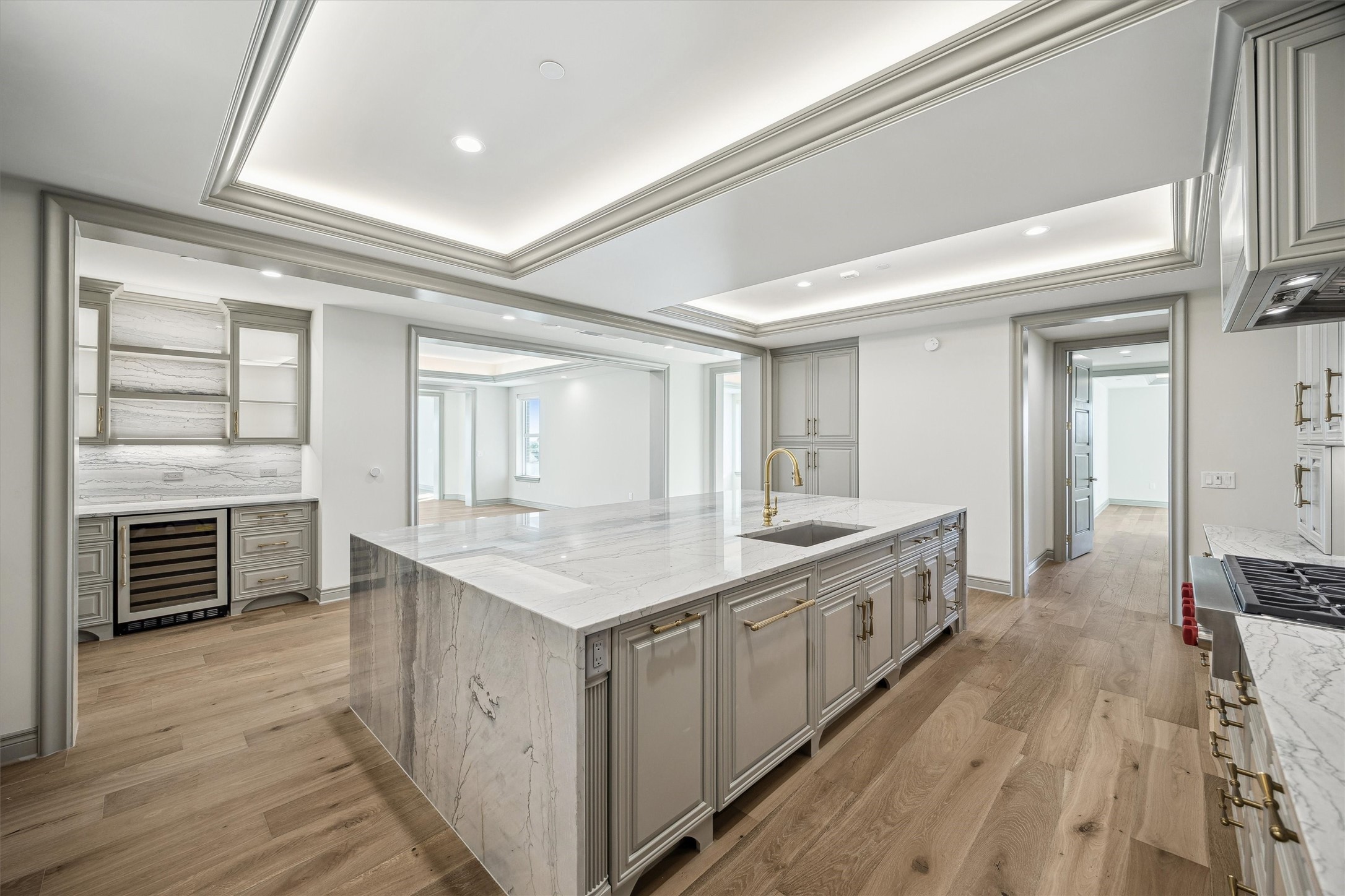 1717 Bissonnet Street, Unit 1802 Houston, TX 77005 - Photo 5 of 46 Panel front wine cooler, open shelving and glass front cabinetry.