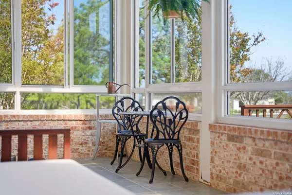 a view of a room with window and furniture