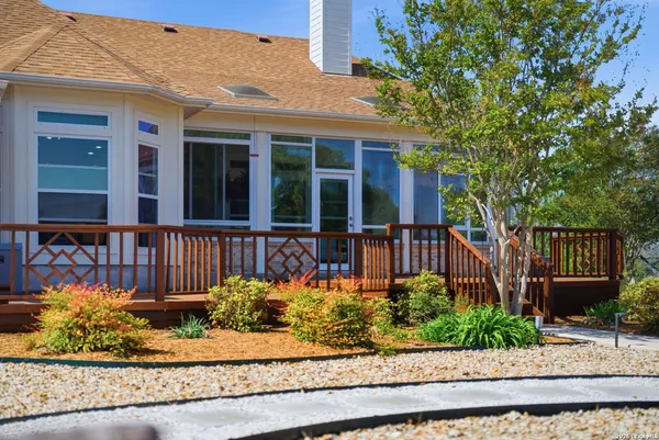 a view of a house with a yard porch and sitting area