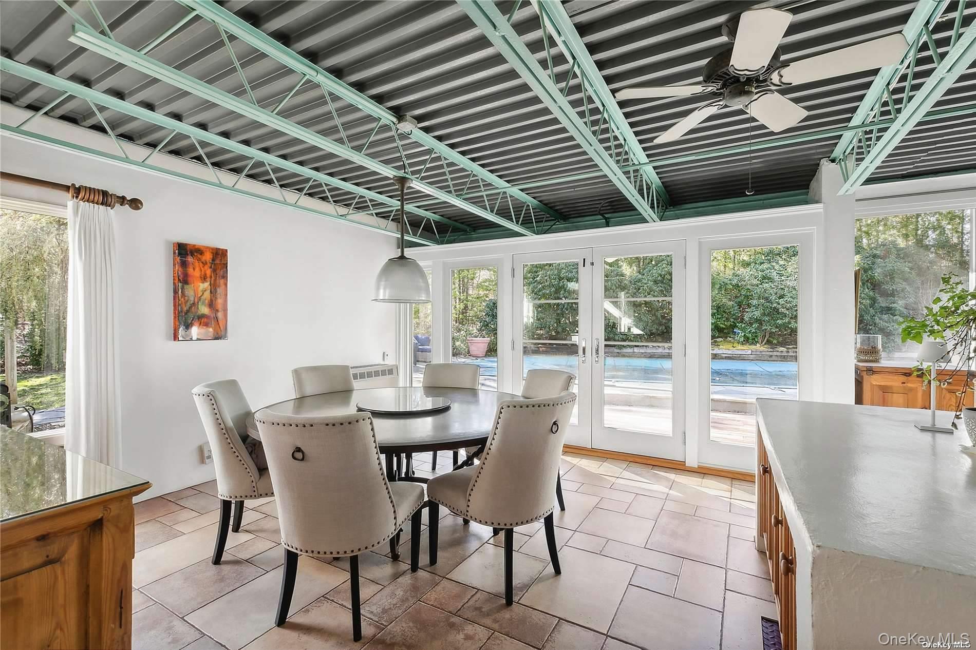 162 Middle Line Southampton, NY 11968 - Photo 5 of 15 a dining room with furniture a rug and a large window