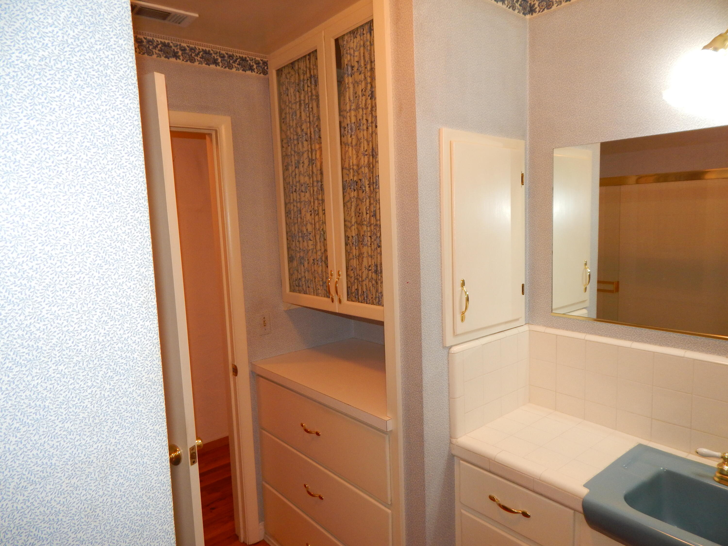 6460 Riverside Drive Redding, CA 96001 - Photo 21 of 81 a bathroom with a shower and a sink