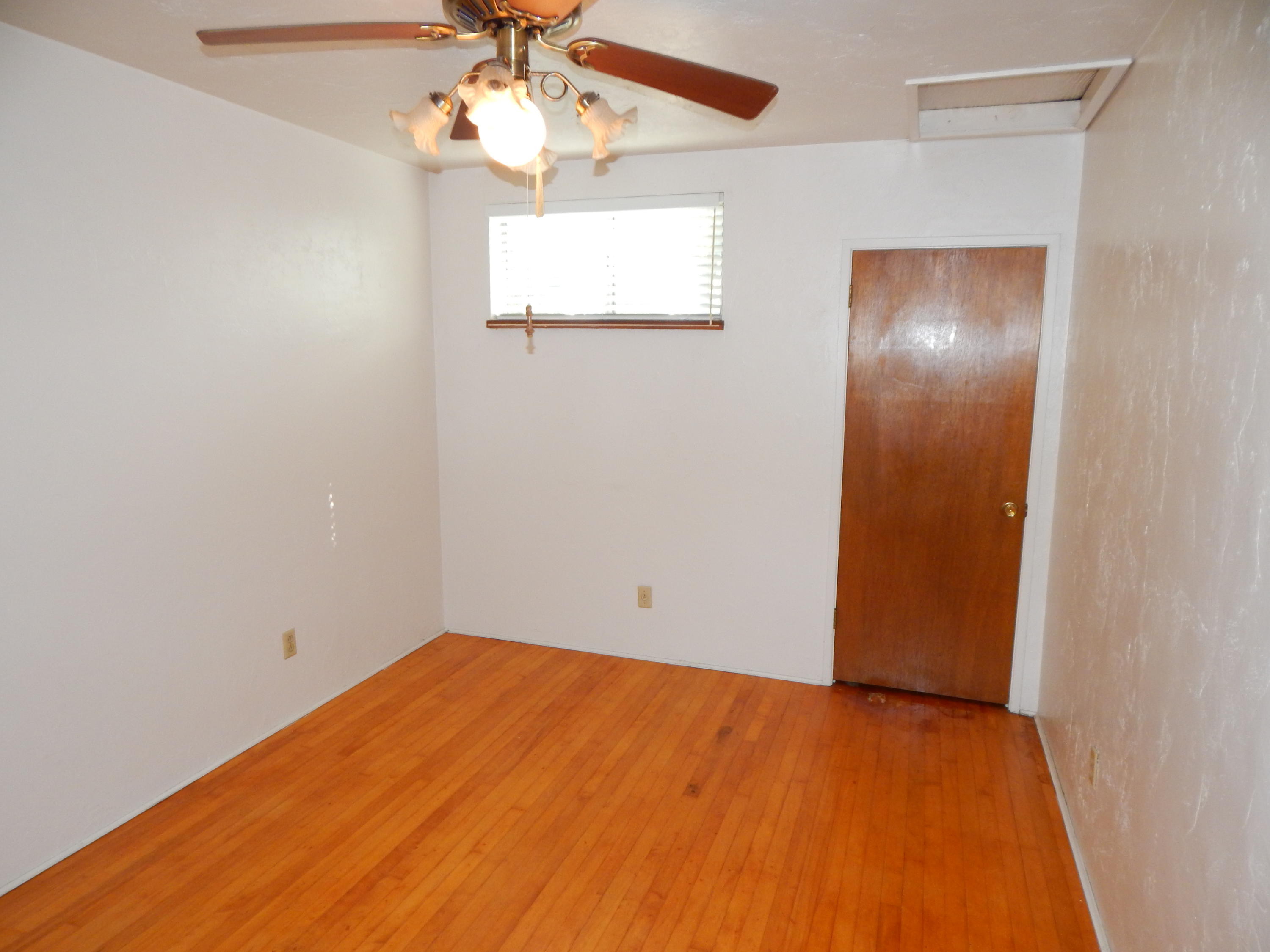 6460 Riverside Drive Redding, CA 96001 - Photo 45 of 81 an empty room with a window and wooden floor