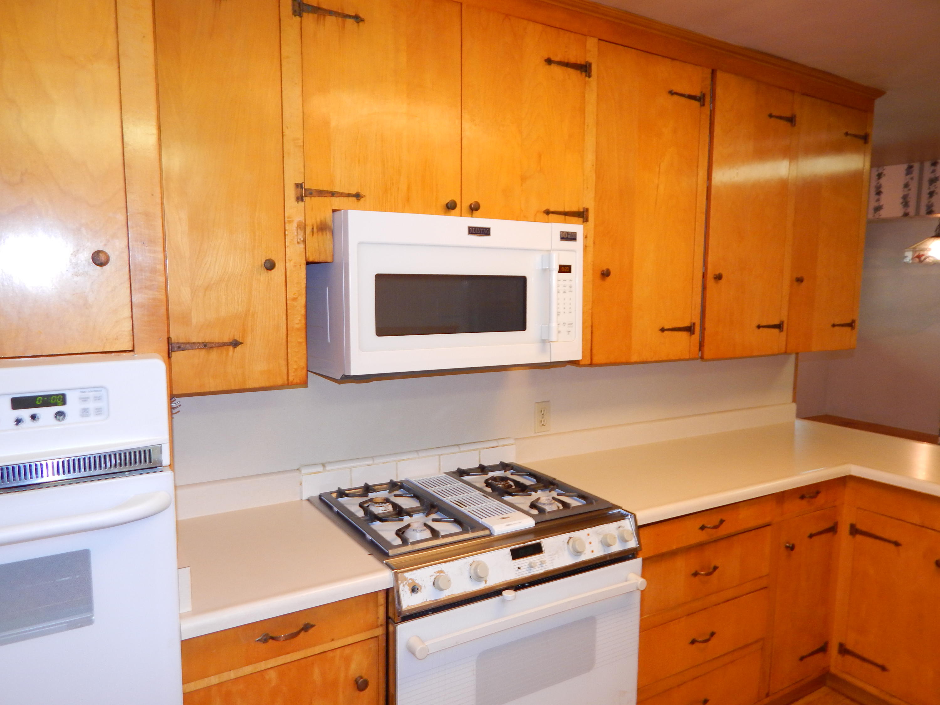 6460 Riverside Drive Redding, CA 96001 - Photo 58 of 81 a kitchen with stainless steel appliances a stove and a microwave