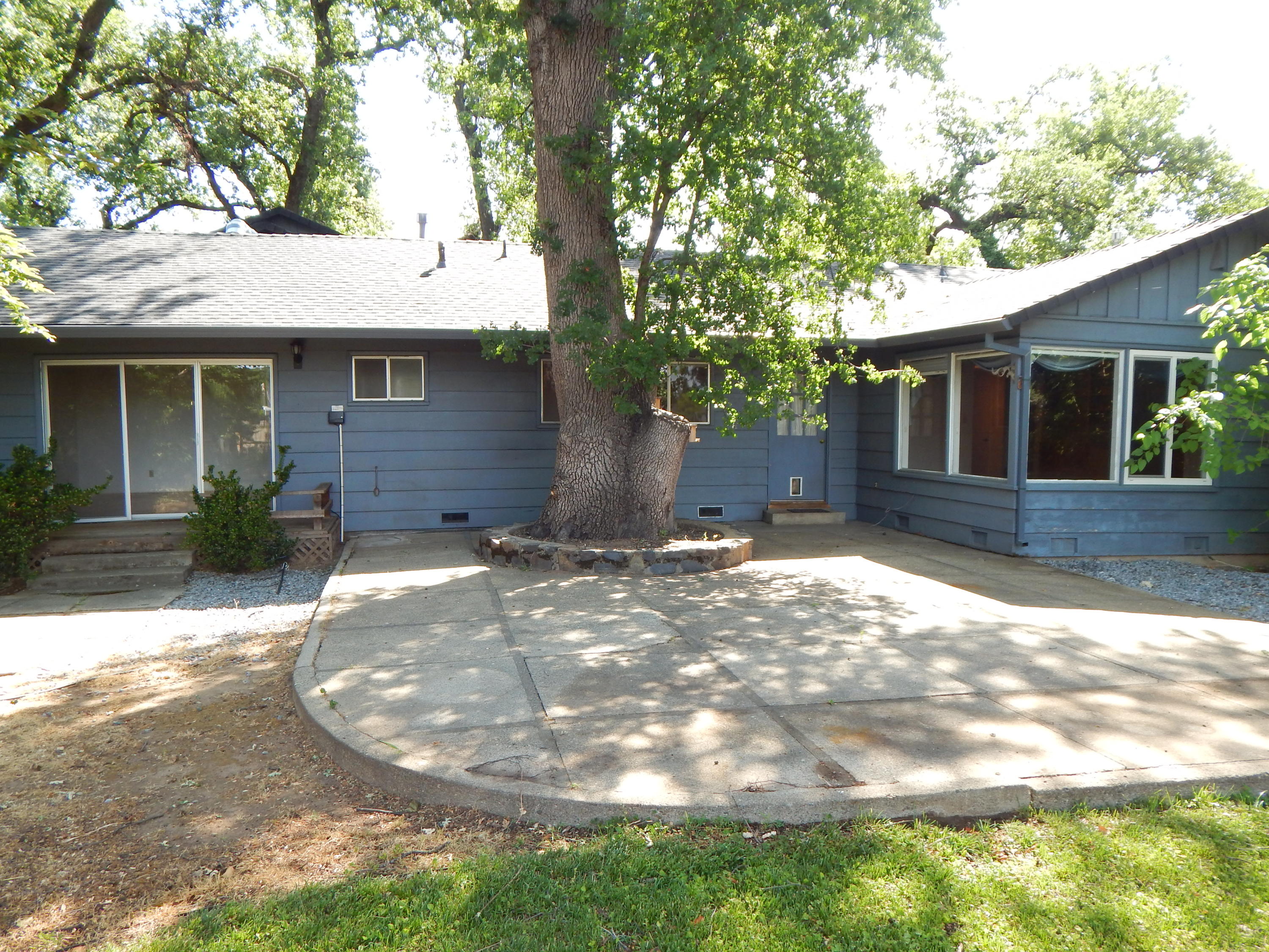 6460 Riverside Drive Redding, CA 96001 - Photo 76 of 81 a backyard of a house with yard and outdoor seating
