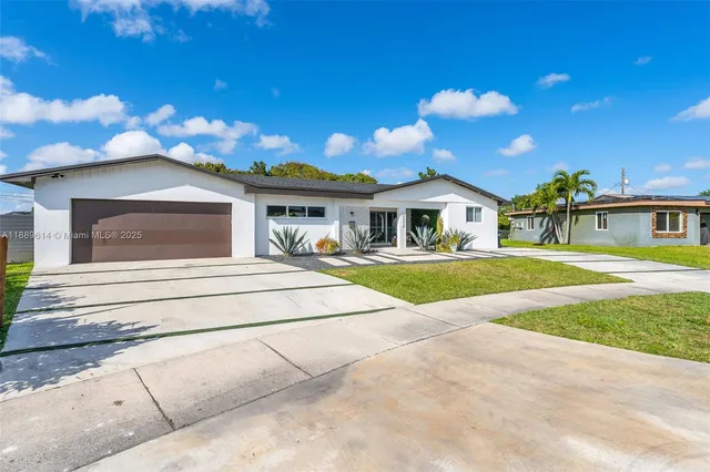 a view of house with outdoor space and swimming pool