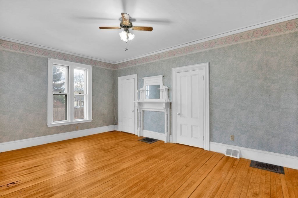 37 School Street Merrimac, MA 01860 - Photo 11 of 34 a view of an empty room with a window and wooden floor