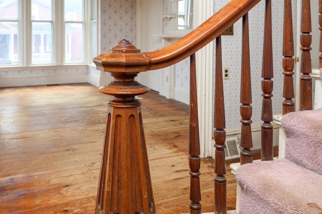 37 School Street Merrimac, MA 01860 - Photo 15 of 34 a view of a hallway with furniture and wooden floor