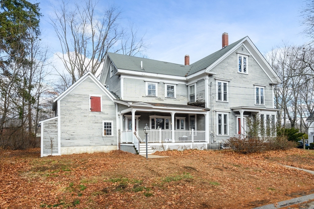 37 School Street Merrimac, MA 01860 - Photo 2 of 34 a front view of a house with a yard and garage