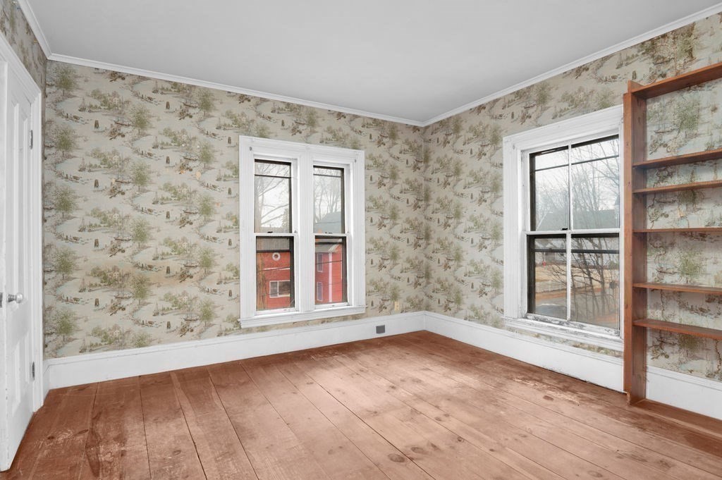 37 School Street Merrimac, MA 01860 - Photo 23 of 34 an empty room with wooden floor and windows