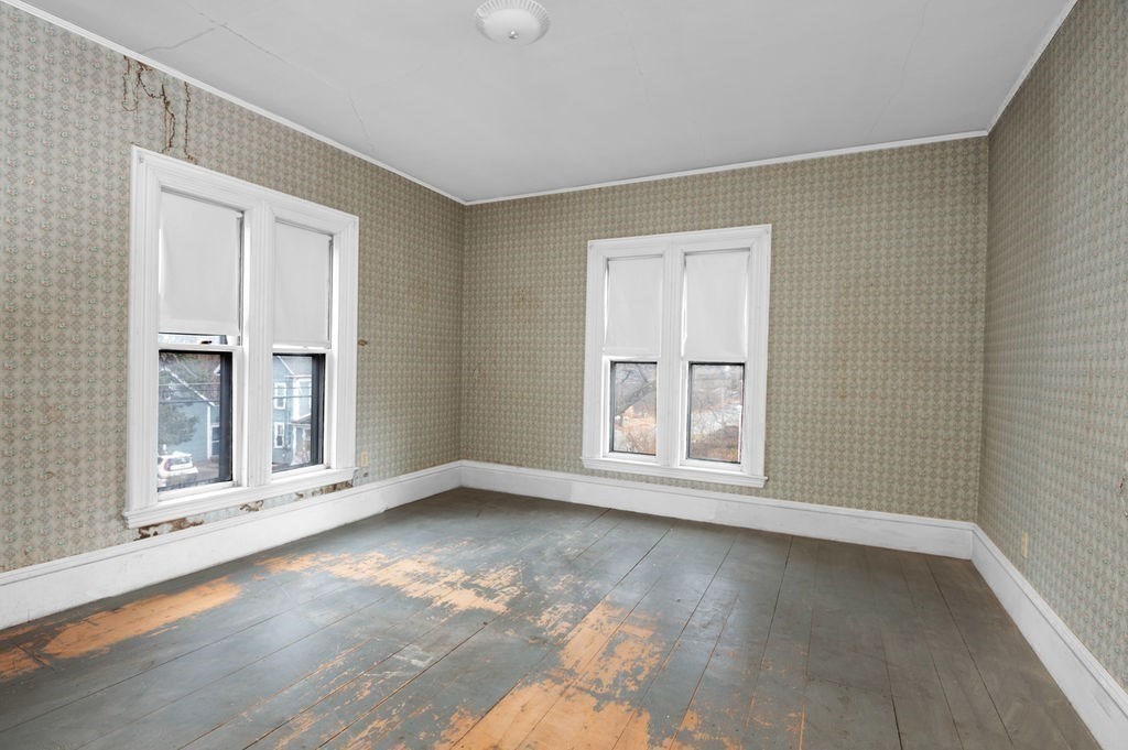 37 School Street Merrimac, MA 01860 - Photo 25 of 34 an empty room with wooden floor and windows
