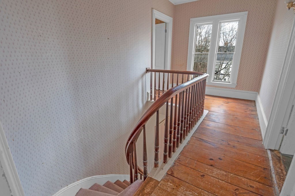 37 School Street Merrimac, MA 01860 - Photo 28 of 34 a view of a hallway with wooden floor and stairs