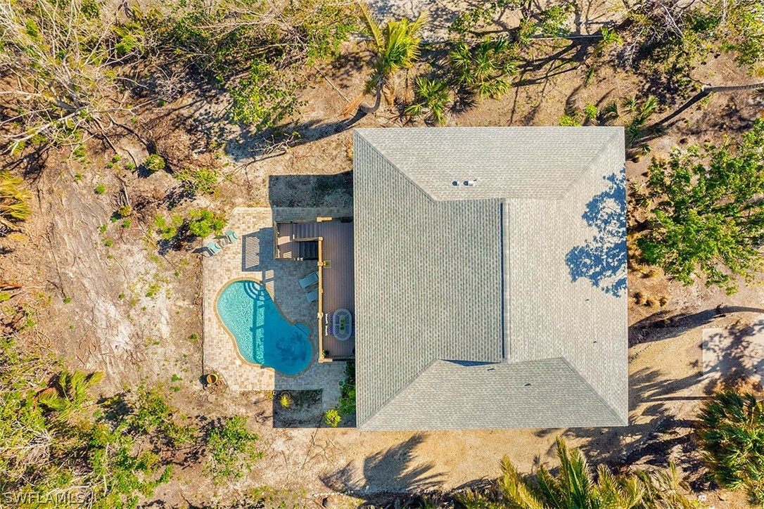 1447 Albatross Road Sanibel, FL 33957 - Photo 1 of 29 a view of a house with a tree