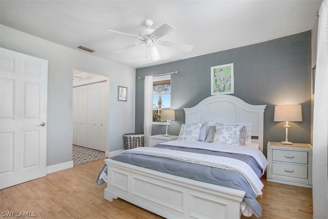 1447 Albatross Road Sanibel, FL 33957 - Photo 14 of 29 a bedroom with a bed and a night stand