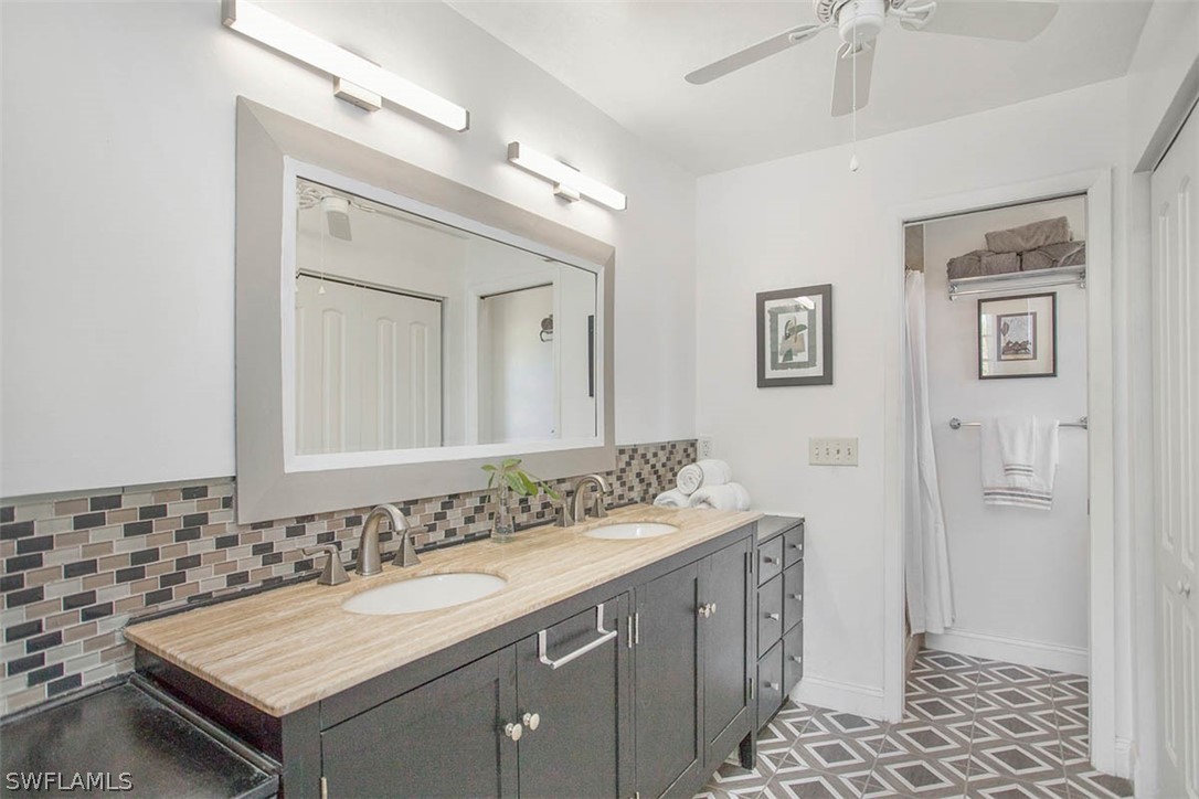 1447 Albatross Road Sanibel, FL 33957 - Photo 15 of 29 a bathroom with a sink and a mirror