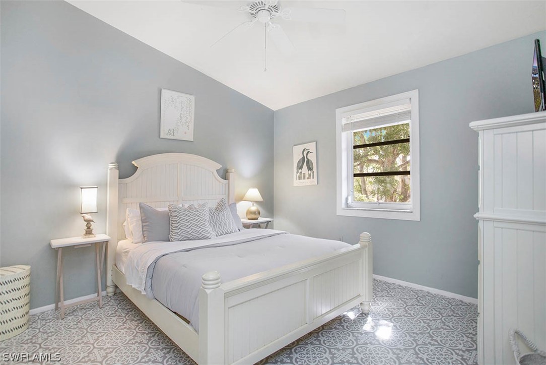 1447 Albatross Road Sanibel, FL 33957 - Photo 19 of 29 a bedroom with a bed and a window