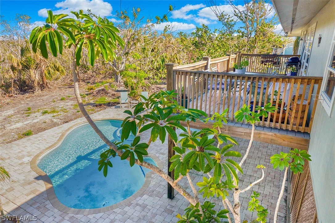 1447 Albatross Road Sanibel, FL 33957 - Photo 23 of 29 a view of a backyard