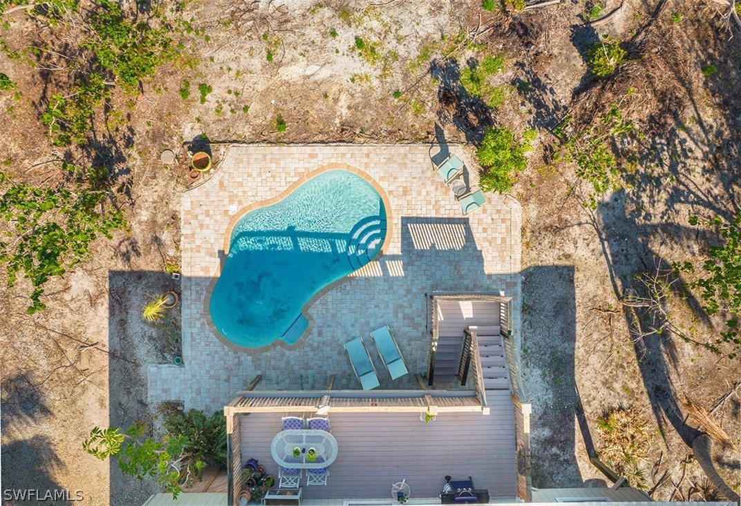 1447 Albatross Road Sanibel, FL 33957 - Photo 24 of 29 an aerial view of a house with a yard