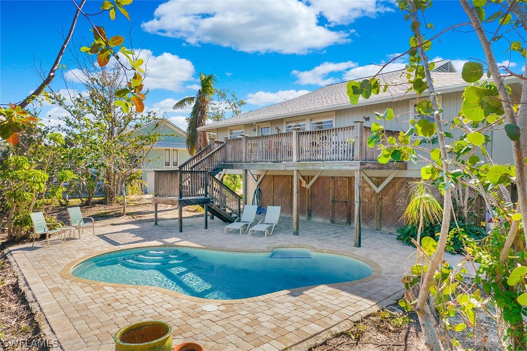 1447 Albatross Road Sanibel, FL 33957 - Photo 25 of 29 a view of a backyard