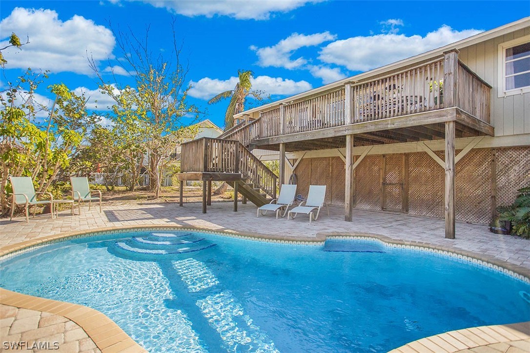 1447 Albatross Road Sanibel, FL 33957 - Photo 26 of 29 a view of a house with a yard