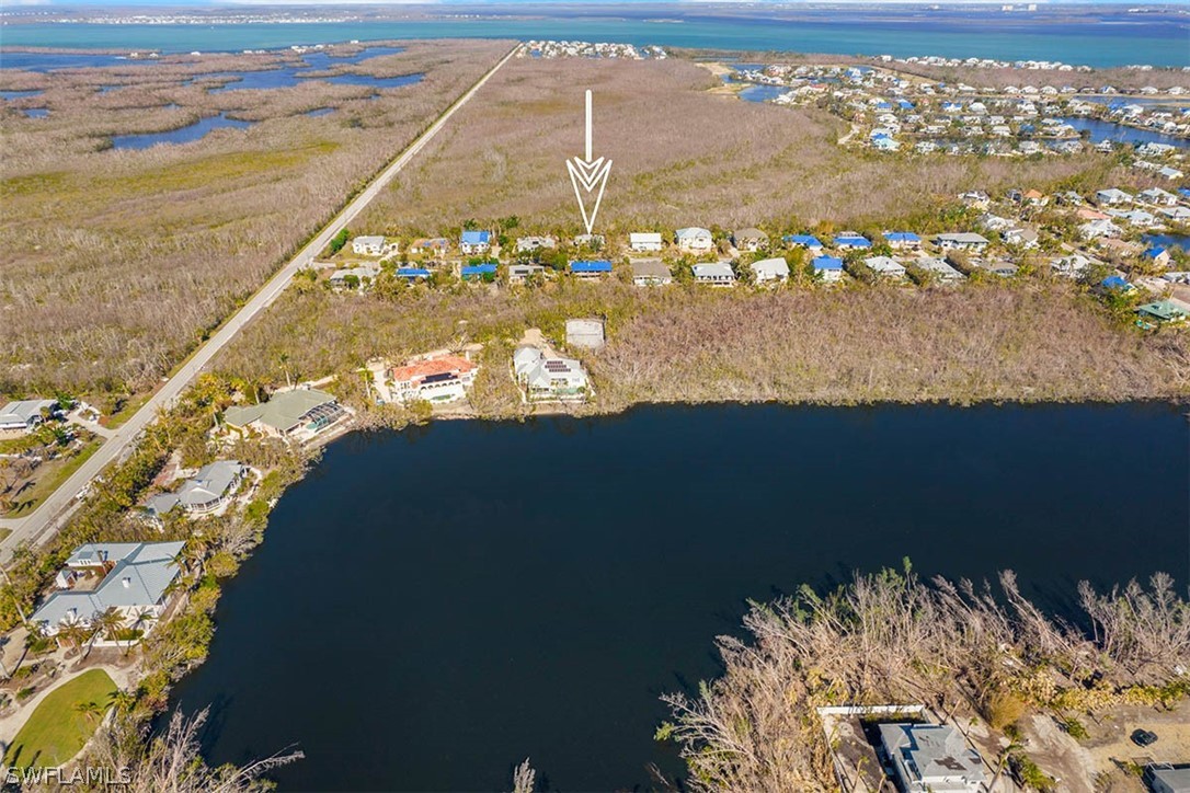 1447 Albatross Road Sanibel, FL 33957 - Photo 28 of 29 a view of ocean from a balcony