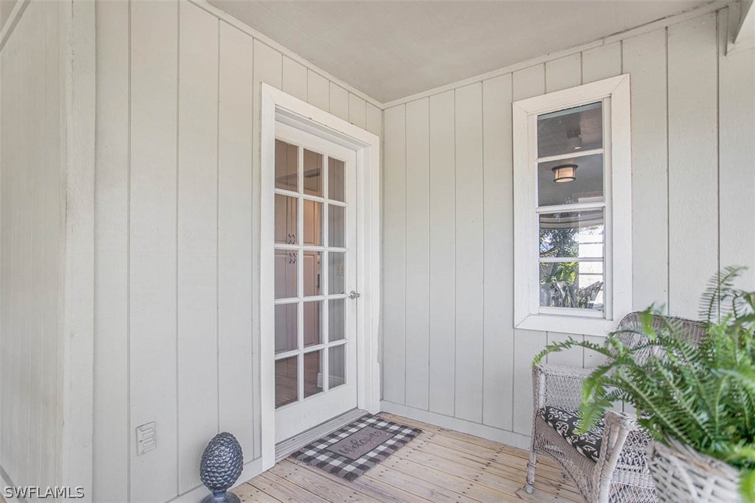 1447 Albatross Road Sanibel, FL 33957 - Photo 4 of 29 a view of front door with wooden floor