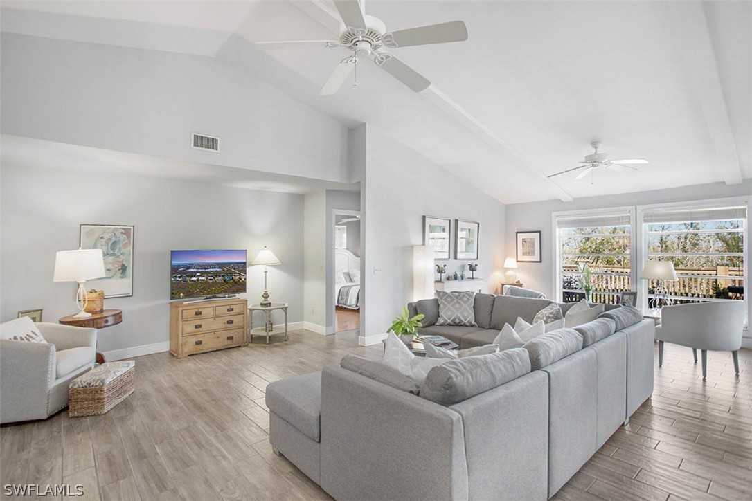1447 Albatross Road Sanibel, FL 33957 - Photo 6 of 29 a living room with furniture and a flat screen tv